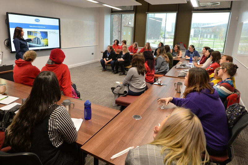 A classroom of women listening to Marianne Whitfield's presentation